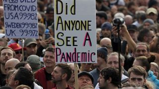 People take part in a 'We Do Not Consent' rally at Trafalgar Square, organised by Stop New Normal, to protest against coronavirus restrictions, in London, Saturday, Sept. 26.