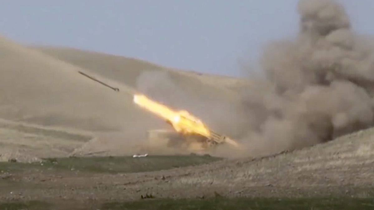 In this image taken from footage released by Azerbaijan's Defense Ministry an Azerbaijan's rocket launches from missile system at the contact line of Nagorno-Karabakh
