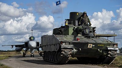 In this photo provided by the Swedish Armed Forces on Tuesday, Aug. 25, 2020, troops prepare in the Baltic Sea region.