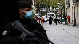 Police guard a street near the scene of the knife attack