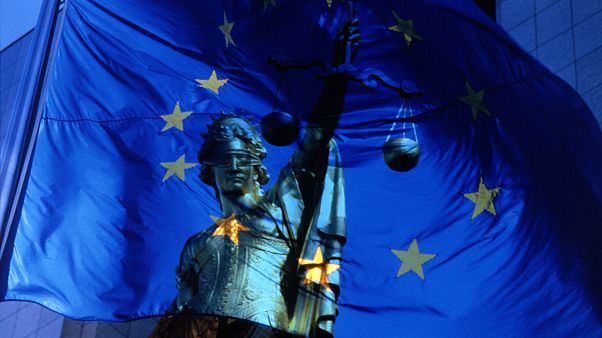 EU flag and justice symbol EU flag and justice symbol