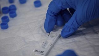 A Madrid Emergency Service (SUMMA) health workers conducts a rapid antigen test for COVID-19 in the southern neighbourhood of Vallecas in Madrid, Spain. Sept. 29, 2020.