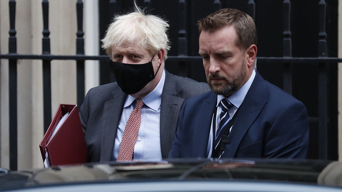 Boris Johnson flanked by his bodyguard leaves 10 Downing Street for the House of Commons.