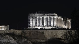A new lighting system illuminates the ancient Acropolis hill in Athens, Wednesday, Sept. 30, 2020. 