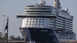 The UK government is considering using cruise ships, possibly similar to this one docked near Athens this week, to process asylum seekrs