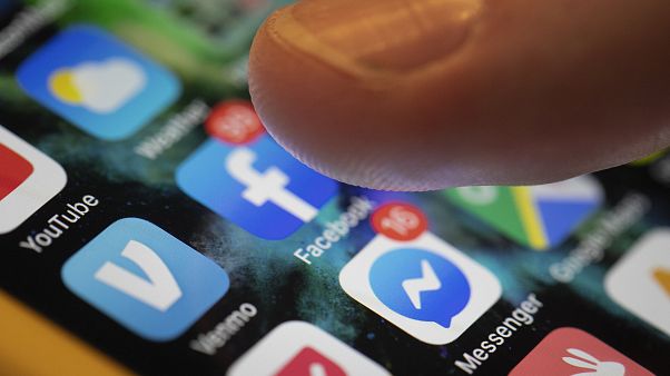 In this Aug. 11, 2019, file photo an iPhone displays the apps for Facebook and Messenger. In this Aug. 11, 2019, file photo an iPhone displays the apps for Facebook and Messenger.
