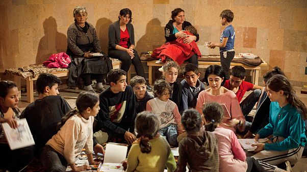 Women and children read books in a bomb shelter as they seek refuge from shelling in Stepanakert/Khankendi, in region of Nagorno-Karabakh. October 1, 2020 Women and children read books in a bomb shelter as they seek refuge from shelling in Stepanakert/Khankendi, in region of Nagorno-Karabakh. October 1, 2020