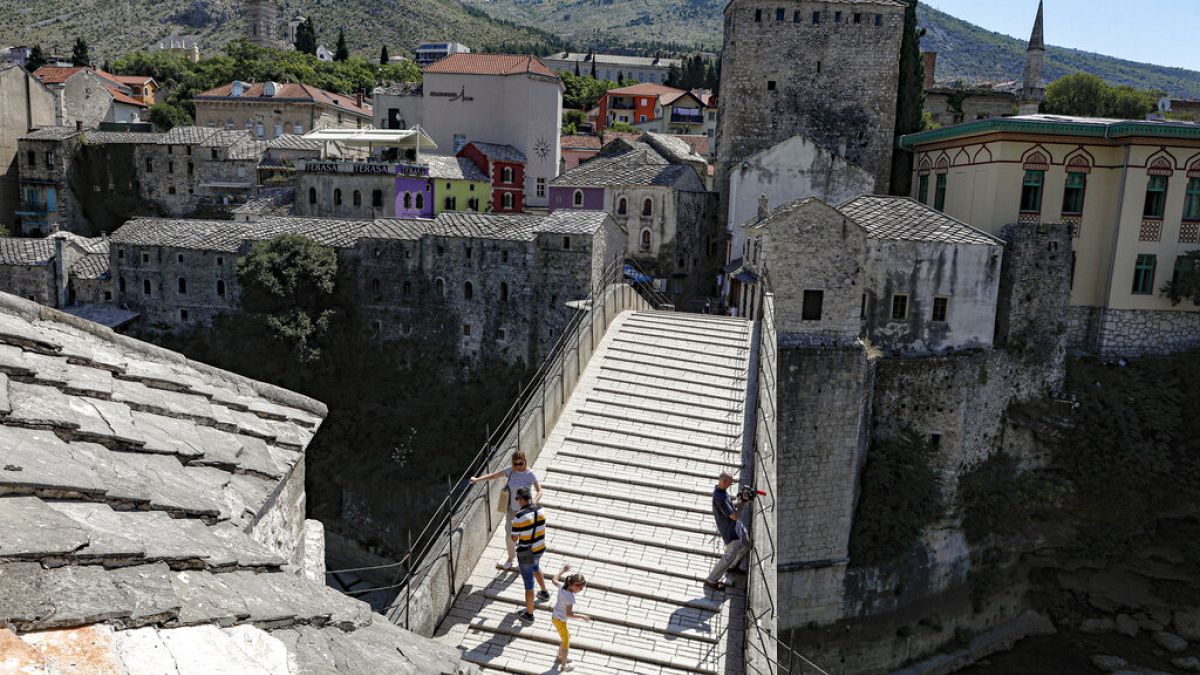 The Old Bridge in Mostar, one of Bosnia's best known landmarks, usually bustling with tourists this time of the year, is all but deserted, Thursday, July 2, 2020.