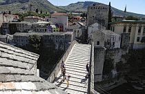 The Old Bridge in Mostar, one of Bosnia's best known landmarks, usually bustling with tourists this time of the year, is all but deserted, Thursday, July 2, 2020.