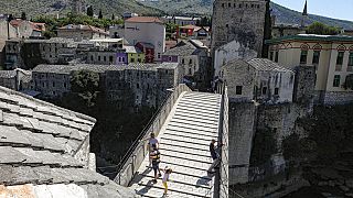 The Old Bridge in Mostar, one of Bosnia's best known landmarks, usually bustling with tourists this time of the year, is all but deserted, Thursday, July 2, 2020.