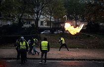 FILE - A protester throws a molotov cocktail during a "Yellow Vest" protest on December 1, 2018 in Paris.