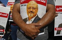 People hold posters of slain Saudi journalist Jamal Khashoggi, near the Saudi Arabia consulate in Istanbul.