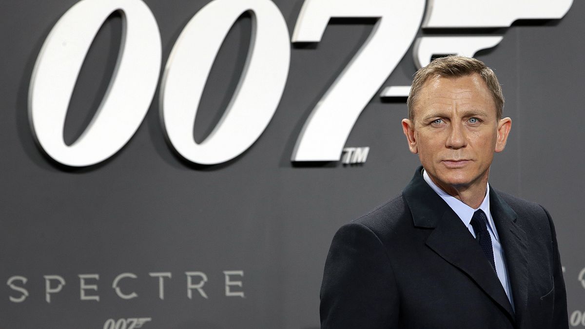 This is a Wednesday, Oct. 28, 2015 file photo of actor Daniel Craig poses for the media as he arrives for the German premiere of the James Bond movie "Spectre" in Berlin
