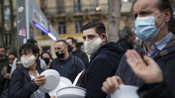 Restaurant and bar owners bang plates together and chant at a demonstration against restaurant and bar closures in Marseille, southern France, Friday Oct. 2, 2020. Restaurant and bar owners bang plates together and chant at a demonstration against restaurant and bar closures in Marseille, southern France, Friday Oct. 2, 2020.