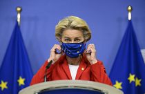 FIle photo: EU Commission President Ursula von der Leyen takes off her protective mask prior to making a statement in Brussels. Oct. 1, 2020.