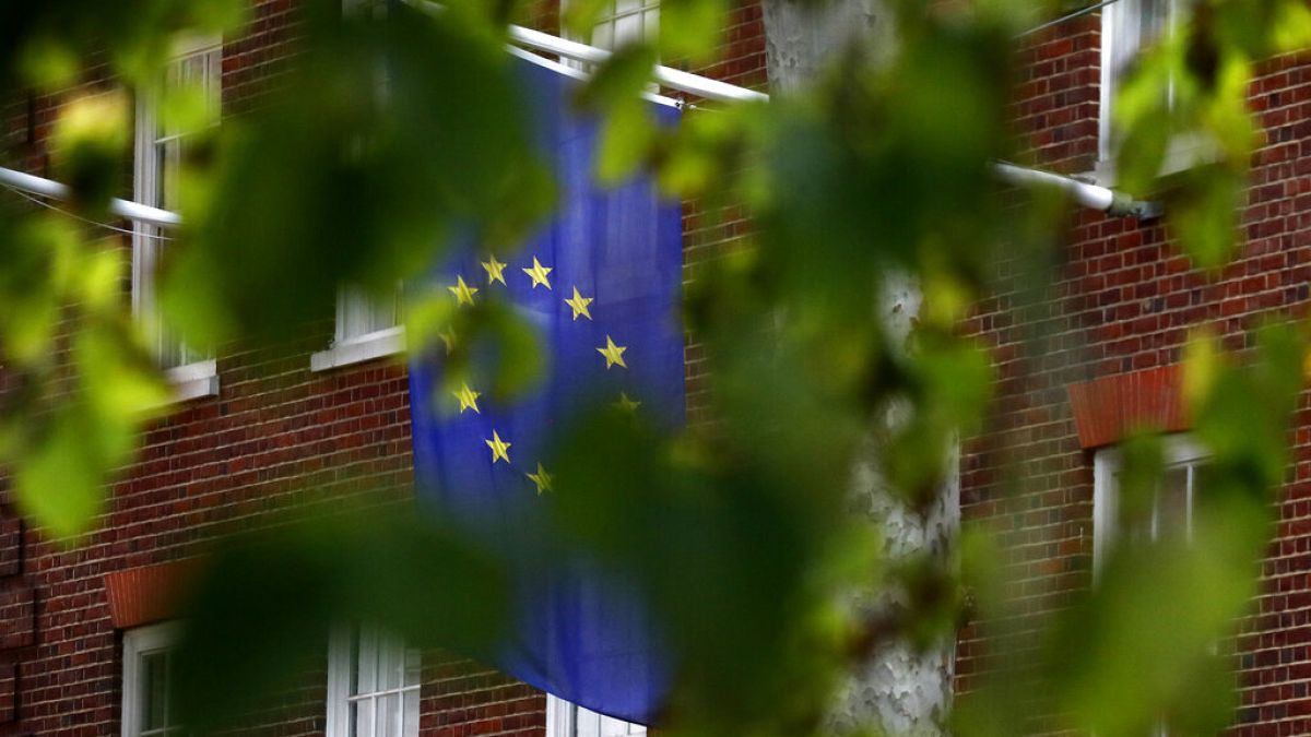 The EU flag hangs from Europa House in London, Tuesday, Sept. 29, 2020.