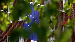 The EU flag hangs from Europa House in London, Tuesday, Sept. 29, 2020.