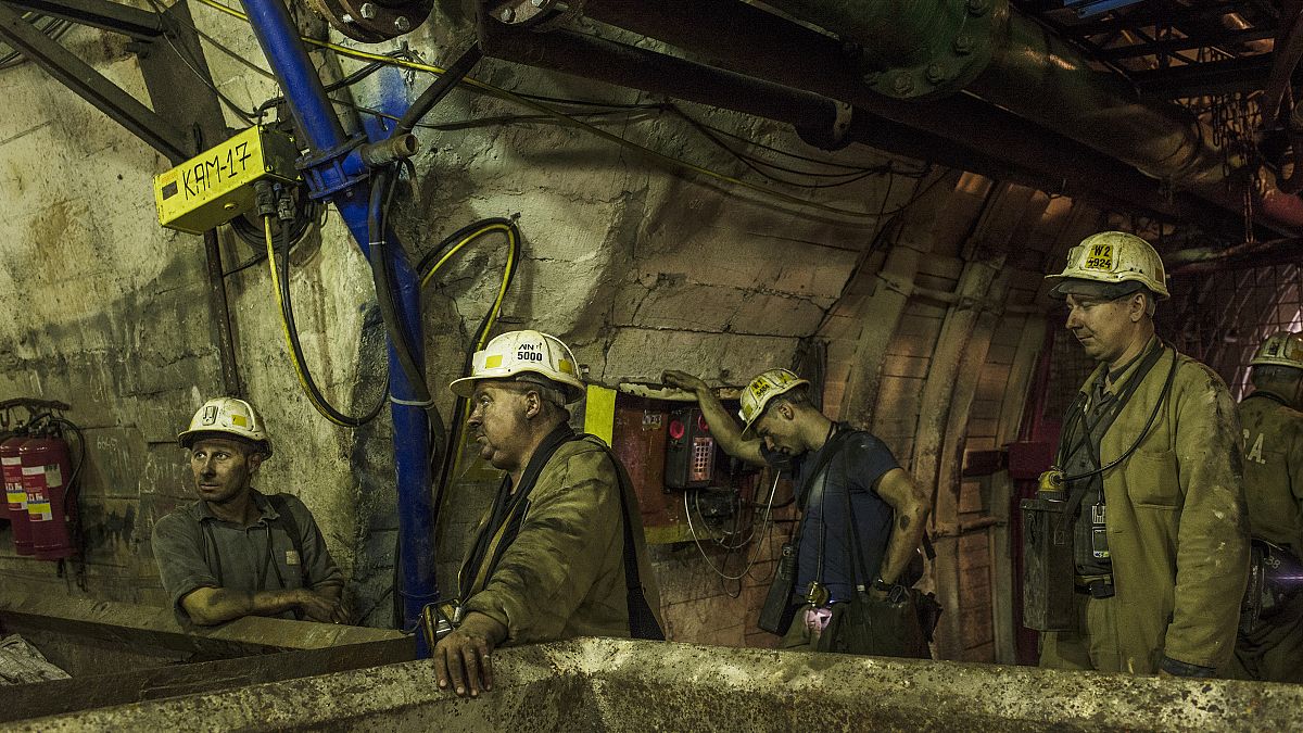 End of work for the group of miners who are waiting for an elevator to go back to the surface after their work shift. Ornantowice, Poland