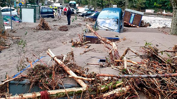 A man stands in the middle of a flooded street in Breil-sur-Roya, near the border with Italy, Saturday Oct. 3, 2020. A man stands in the middle of a flooded street in Breil-sur-Roya, near the border with Italy, Saturday Oct. 3, 2020.