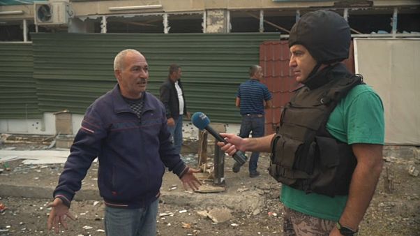 Euronews reporter Emin Ibrahimov (right) Euronews reporter Emin Ibrahimov (right)