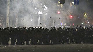 Riot police move to disperse protesters during a rally against the results of a parliamentary vote in Bishkek, Kyrgyzstan, Monday, Oct. 5, 2020.