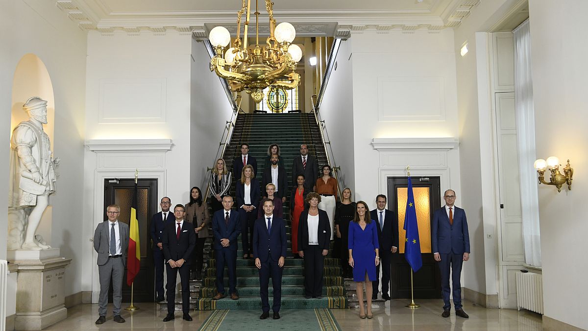 New Belgian Prime Minister Alexander De Croo, centre, with new members of the Belgian government after a swearing-in ceremony, Brussels, October 1, 2020.