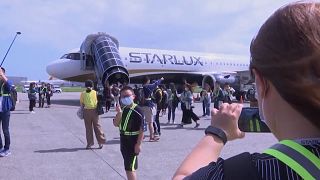 Tourists waiting to embark on a flight to nowhere