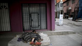 Homeless women sleep outside during a government-ordered lockdown to curb the spread of COVID-19 in Buenos Aires, Argentina on May 6, 2020