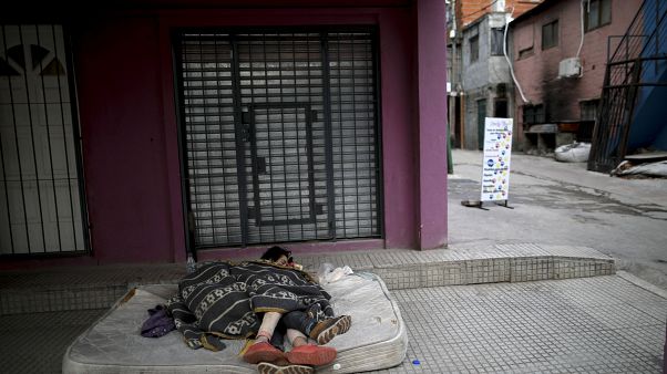 Homeless women sleep outside during a government-ordered lockdown to curb the spread of COVID-19 in Buenos Aires, Argentina on May 6, 2020 Homeless women sleep outside during a government-ordered lockdown to curb the spread of COVID-19 in Buenos Aires, Argentina on May 6, 2020