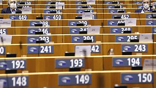 MEPs, wearing face masks to fight against the spread of the coronavirus, attend a plenary session at the European Parliament in Brussels