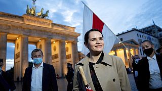 Belarusian opposition leader Svetlana Tikhanovskaya is welcomed by supporters, during a rally, by the Brandenburg Gate in Berlin.