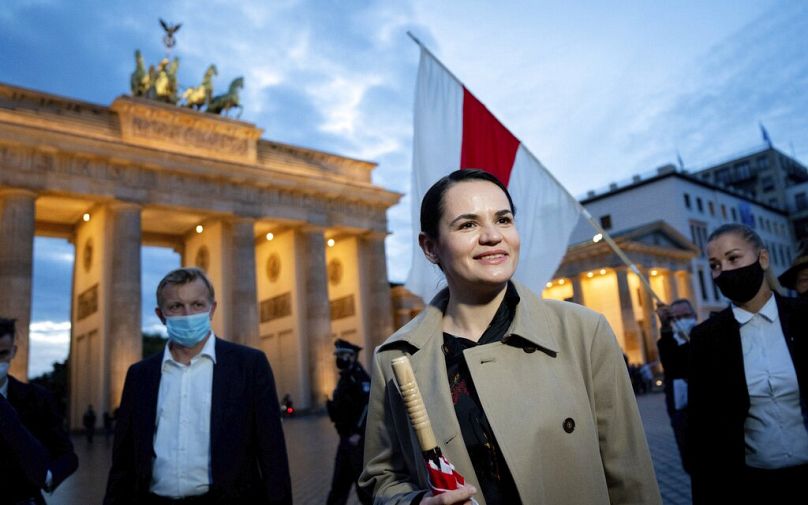 Belarusian opposition leader Svetlana Tikhanovskaya is welcomed by supporters at a rally by the Brandenburg Gate in Berlin, 2020.