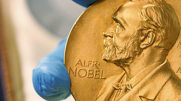File photo: A national library employee shows a gold Nobel Prize medal in Bogota, Colombia. Oct. 9, 2020. File photo: A national library employee shows a gold Nobel Prize medal in Bogota, Colombia. Oct. 9, 2020.