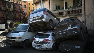 Cars stacked on top of each other by clean up crews are pictured in Breil-sur-Roya, near the border with Italy. October 5, 2020