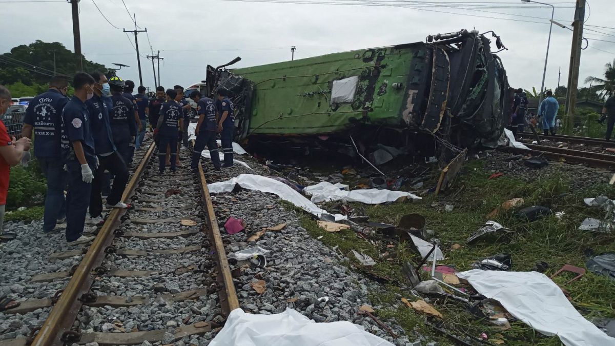 The scene of the  bus-train collision in Chacheongsao province, 80 kilometers (50 miles) east of Bangkok, Thailand, Sunday, Oct. 11, 2020. 