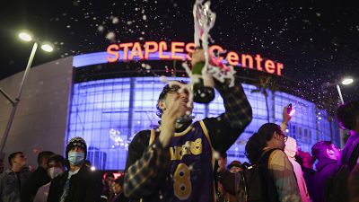Los Angeles Lakers fans celebrate outside of Staples Center