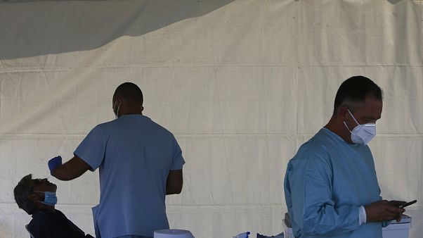 A health worker carries out COVID-19 tests of a resident of Larnaca, a resort town in southern coast of Cyprus A health worker carries out COVID-19 tests of a resident of Larnaca, a resort town in southern coast of Cyprus
