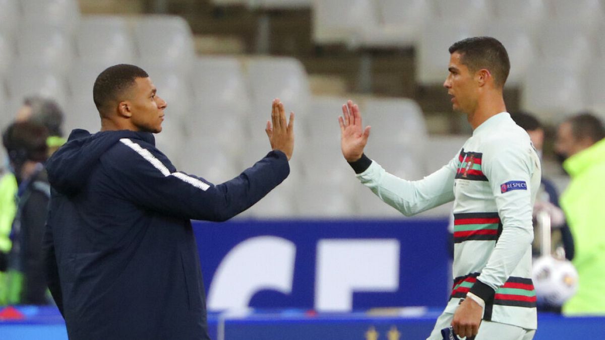 France's Kylian Mbappe and Portugal's Cristiano Ronaldo, right, greet each other at the end of the UEFA Nations League football match between France and Portugal