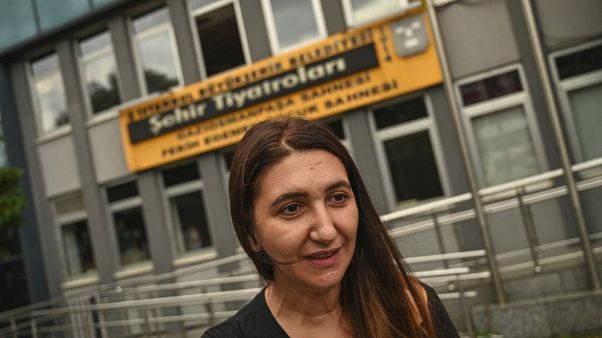 Actress Ruges Kirici speaks to media in front of Istanbul metropolitan municipality theatre building. Actress Ruges Kirici speaks to media in front of Istanbul metropolitan municipality theatre building.