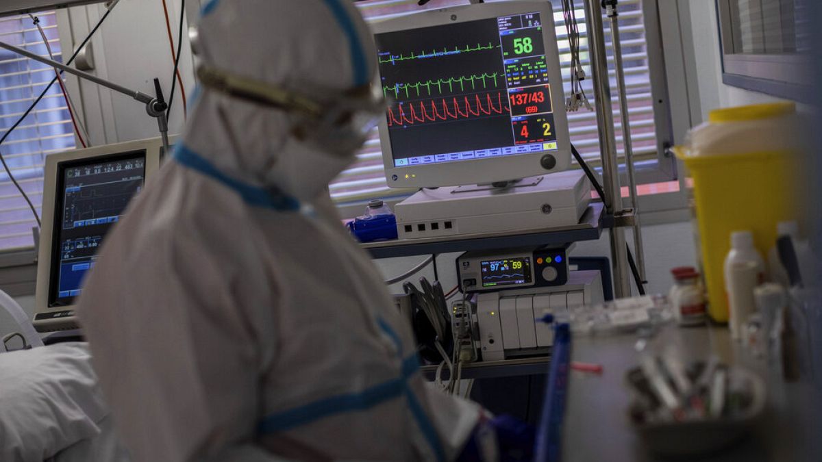 A medical monitor displays the vital life signs of a patient infected with COVID-19 at an ICU on the outskirts of Madrid, October 2020