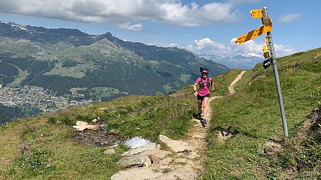 Running along mountain trails in Valais in the Swiss Alps