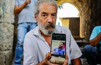 Settembre 2020, Tripoli, Libano: Khaldoun Mohammad, 54 anni, libanese, mostra una foto del figlio, Mohammad Mohammad, scomparso in mare mentre cercava di arrivare a Cipro