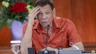 In this photo provided by the Malacanang Presidential Photographers Division, Philippine President Rodrigo Duterte attends a meeting at the Malacanang presidential palace.