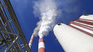 In this photo taken Wednesday, Oct. 3, 2018, smoke rises from the chimneys of Serbia's main coal-fired power station near Kostolac, Serbia. 