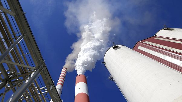 In this photo taken Wednesday, Oct. 3, 2018, smoke rises from the chimneys of Serbia's main coal-fired power station near Kostolac, Serbia. In this photo taken Wednesday, Oct. 3, 2018, smoke rises from the chimneys of Serbia's main coal-fired power station near Kostolac, Serbia.