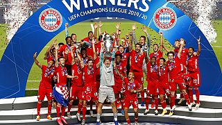 Bayern's goalkeeper Manuel Neuer lifts the trophy after Munich won the Champions League final soccer match.