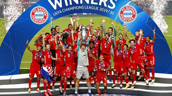 Bayern's goalkeeper Manuel Neuer lifts the trophy after Munich won the Champions League final soccer match. Bayern's goalkeeper Manuel Neuer lifts the trophy after Munich won the Champions League final soccer match.