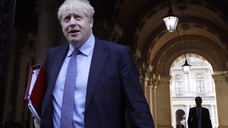 Britain's Prime Minister Boris Johnson returns to Downing Street after attending a Cabinet meeting in London, Tuesday, Oct. 20, 2020.