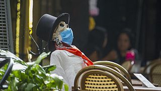 A Calaca is used to keep social distancing measures in Mexico City during Day of the Dead celebrations