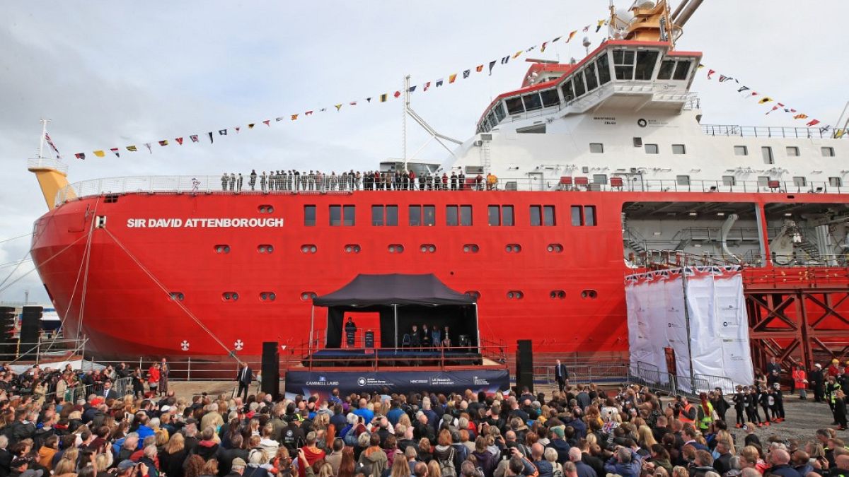 The Duke of Cambridge, Duchess of Cambridge and Sir David Attenborough (seated on the stade) attend the naming ceremony of Britain's new polar research ship. 
